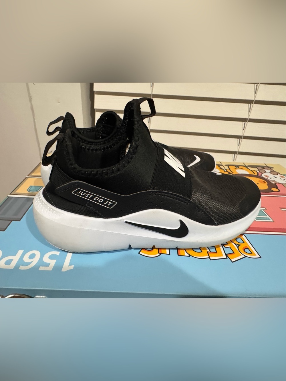 Nike Kids Black and White Slip-On Sneakers with 'Just Do It' Accent